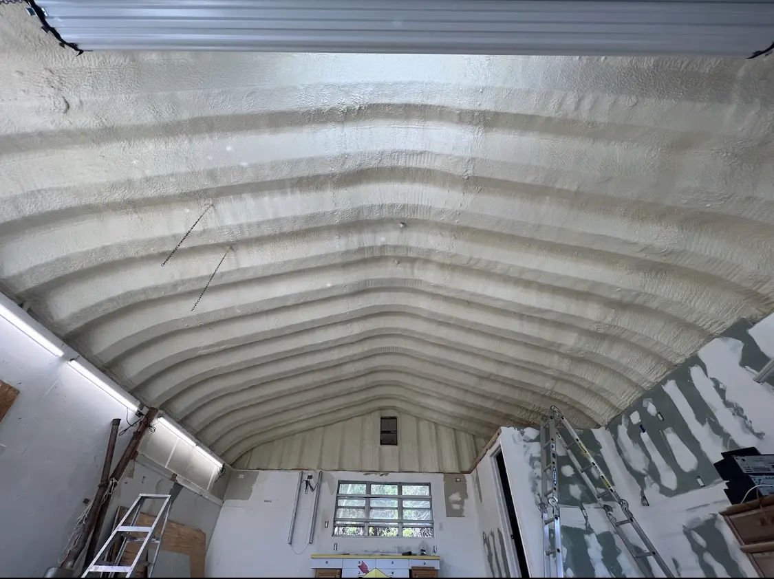 Spray polyurethane foam applied to the underside of a metal roof deck in Benicia